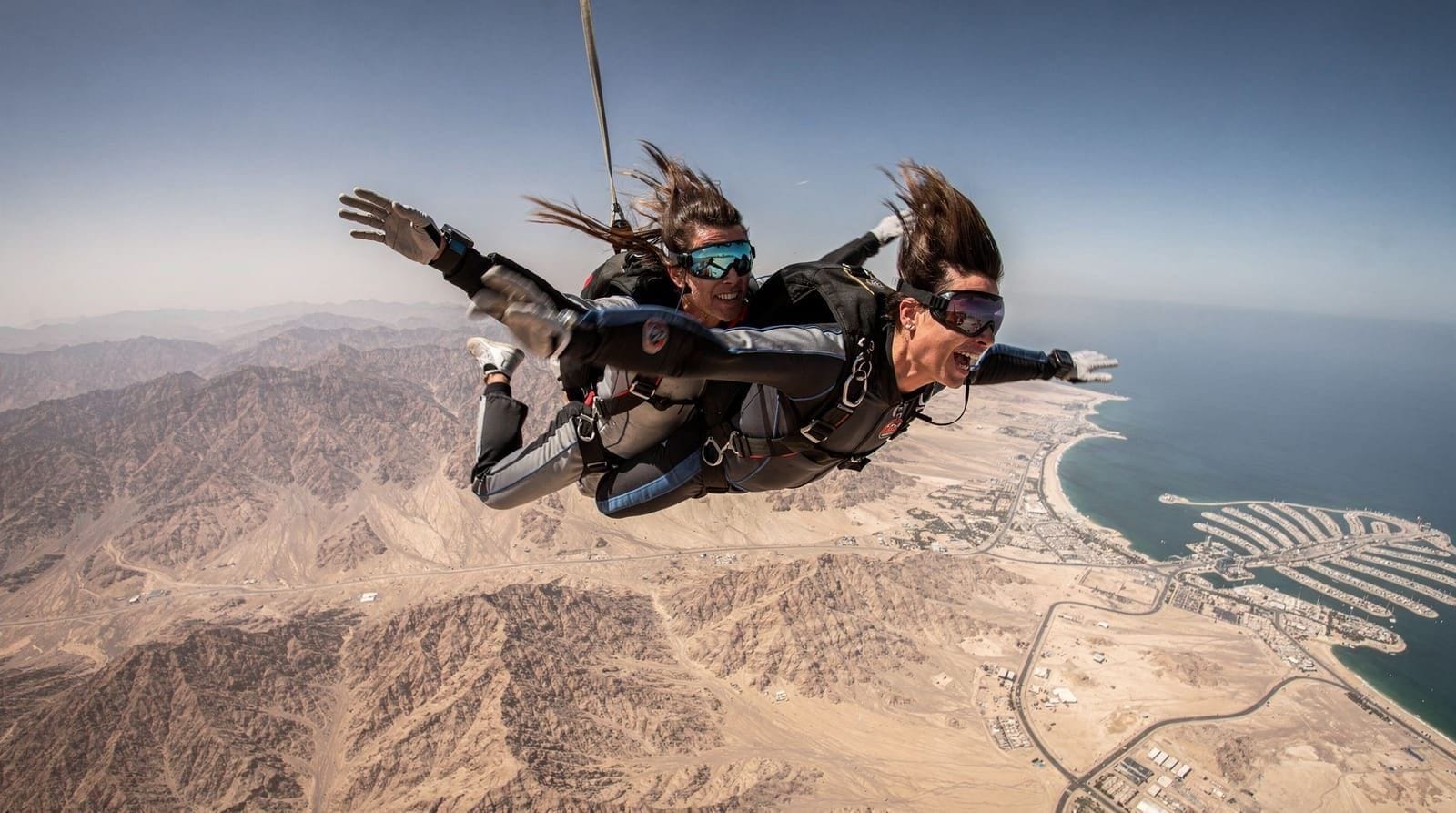 Skydive Dubai: the complete tandem skydiving guide — What a Skydive Dubai tandem jump actually costs, which drop zone to pick, weight